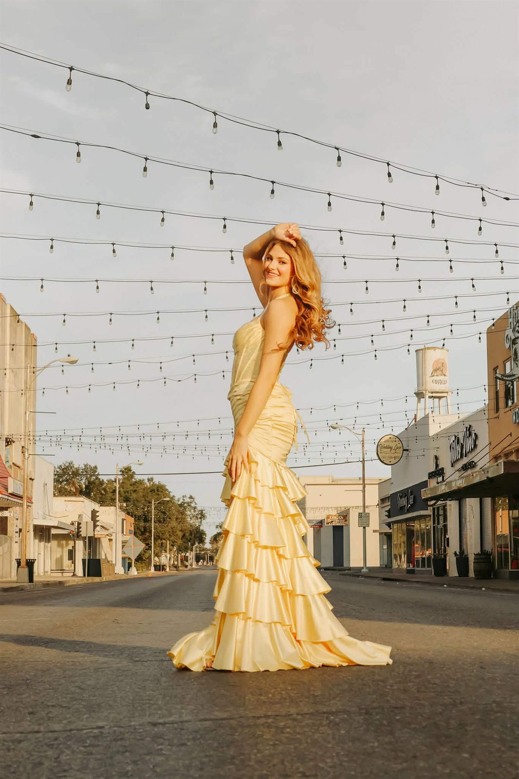 Yellow satin ruffled mermaid prom gown on Main Street