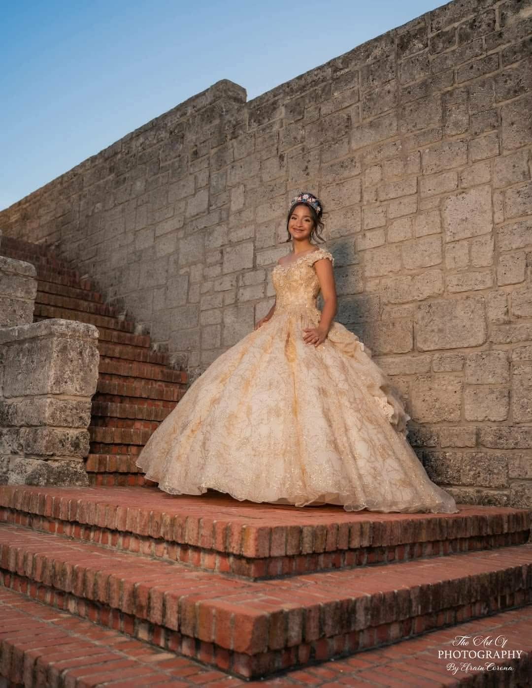 Champagne quinceañera ballgown with off-shoulder sleeves